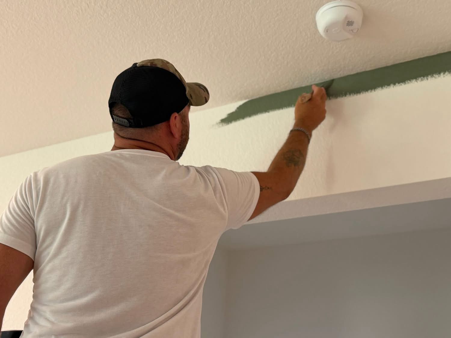 Iaconelli Painting applying paint inside a home